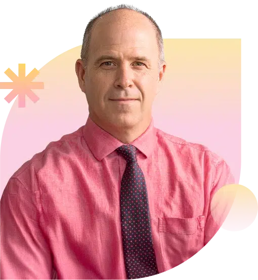 James Lang smiling and swearing a shirt and tie