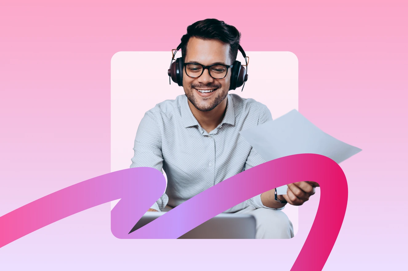 A man wearing headphones and glasses smiles while looking at papers, with a pink and purple ribbon design in the foreground.